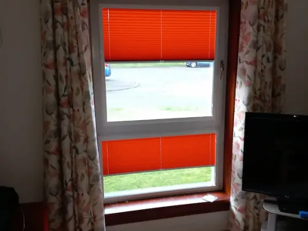 Made-to-measure curtains paired with blinds in an Edinburgh living room