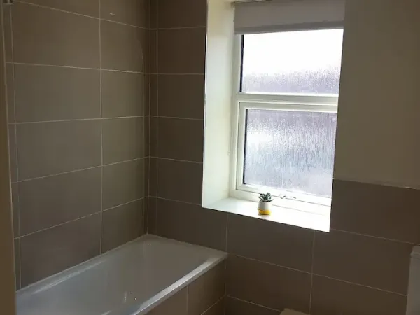 White roller blind in a bathroom