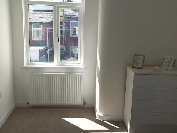 White blackout roller blind in an Edinburgh bedroom