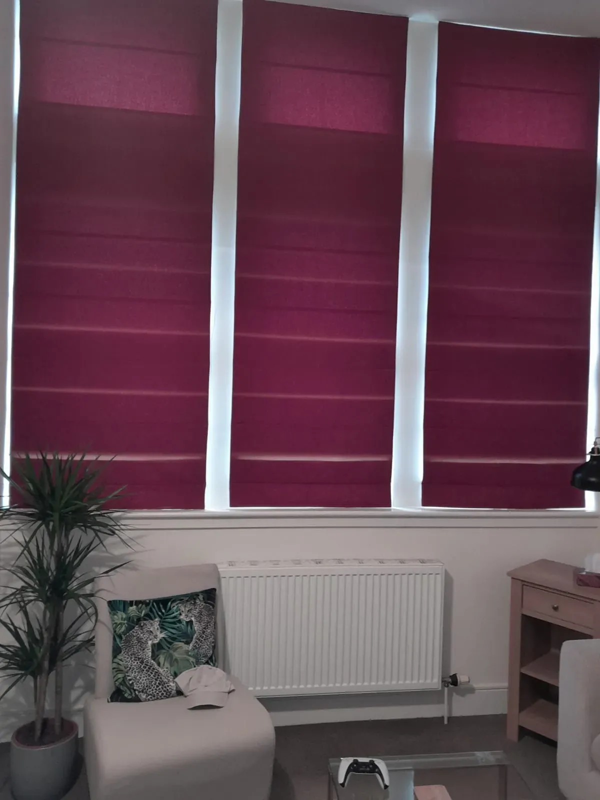 Burgundy roman blinds on a bay window in an Edinburgh living room