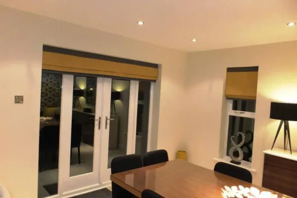 Gold and charcoal roman blinds in an Edinburgh dining room