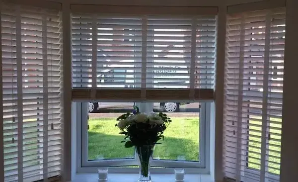 Wooden venetian blinds on a traditional Edinburgh bay window