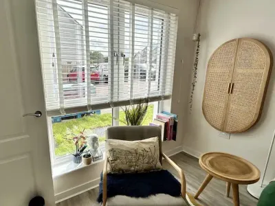 White venetian blinds in a stylish reading nook